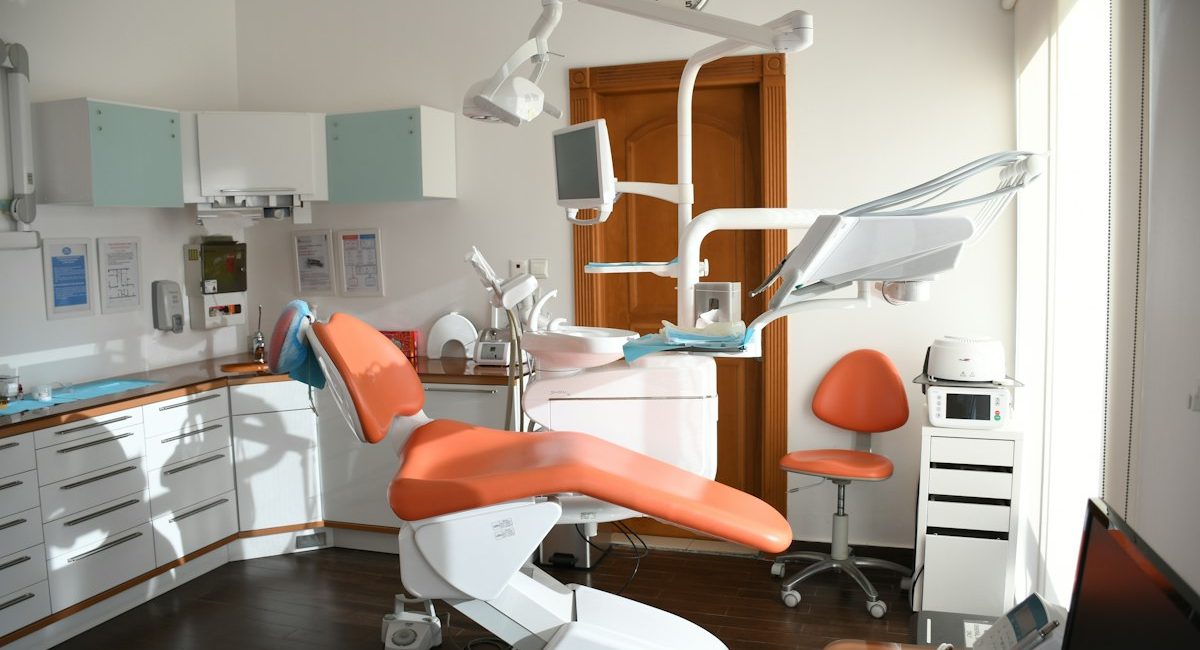 Dentist cleaning a patient’s gums