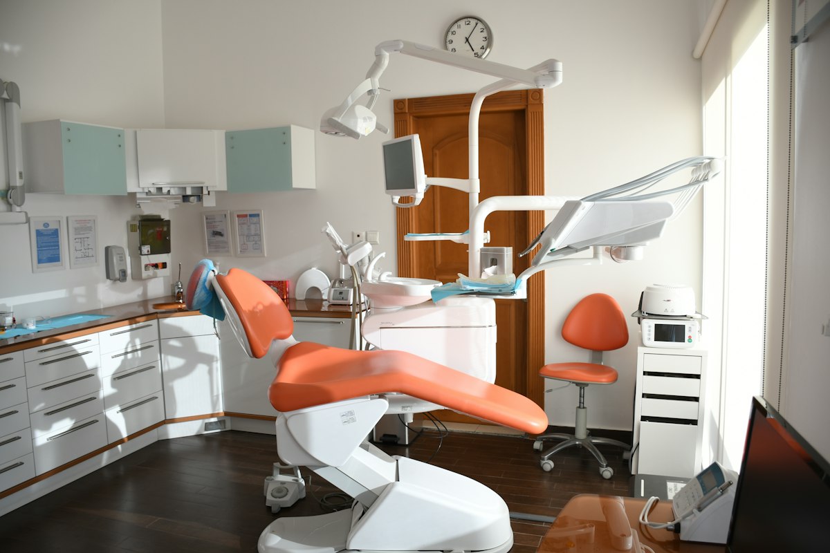 Dentist cleaning a patient’s gums