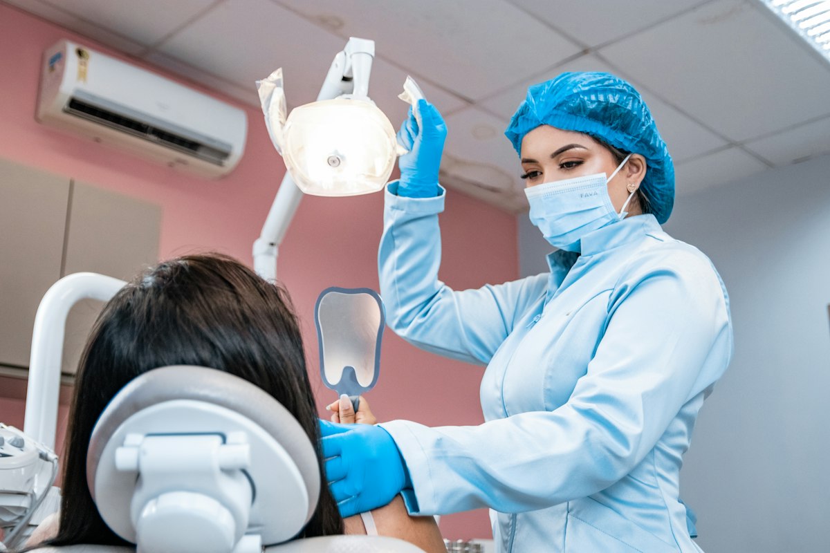 Dentist examining a patient during a routine checkup